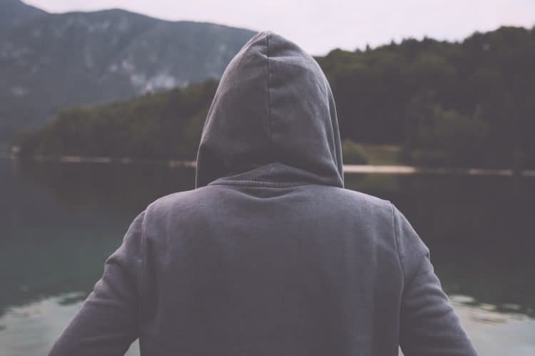 Dealing with Negative people: 7 Simple Strategies Against Haters and Idiots 4 gloomy sad woman standing by the lake P98X7TB dealing with negative people