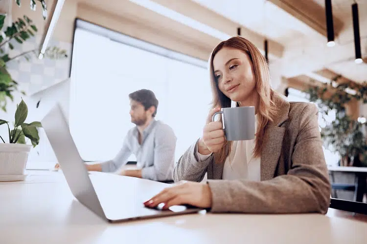 Couple of business partners working together in modern open space office