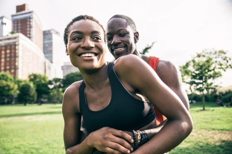 Sportive couple playing and having fun in a park