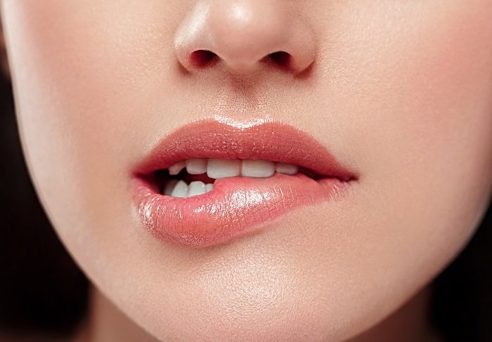 Woman lips mouth biting lip colorful pink