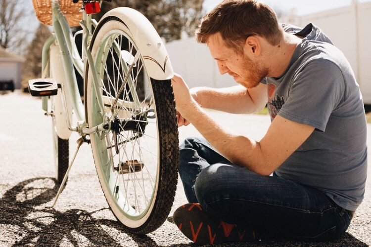 man fixing a pushbike