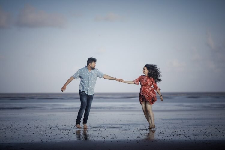 Examining the Health Benefits of Marriage: What Research Suggests 1 health benefits of marriage of couple on a beach