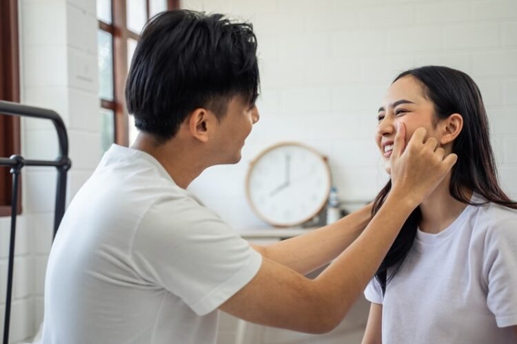 Understanding Sexual Tension in Relationships: 8 Must-have Tips on How to Seduce Your Wife 4 a man touching a woman's face