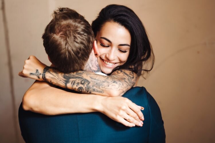 a man and woman hugging