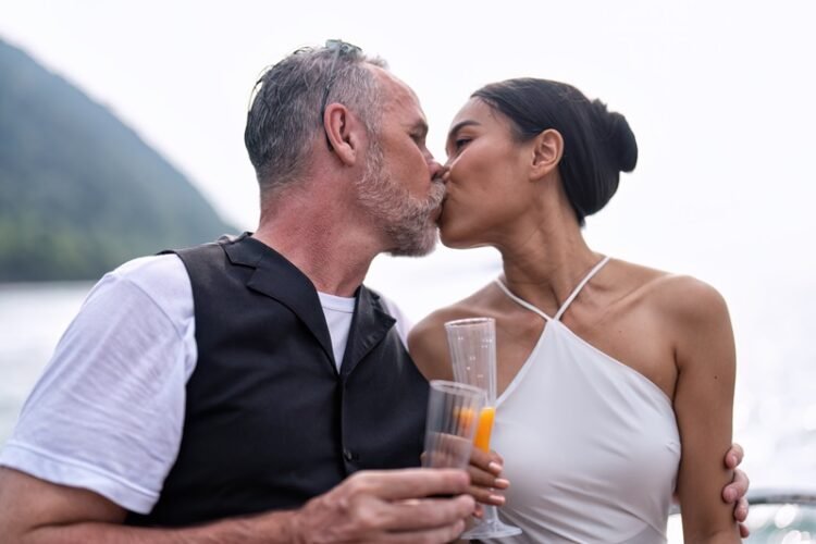 Understanding Sexual Tension in Relationships: 8 Must-have Tips on How to Seduce Your Wife 1 Romantic couple in love with sexual tension have fun sailing in the sea standing on yacht deck enjoy amazing view