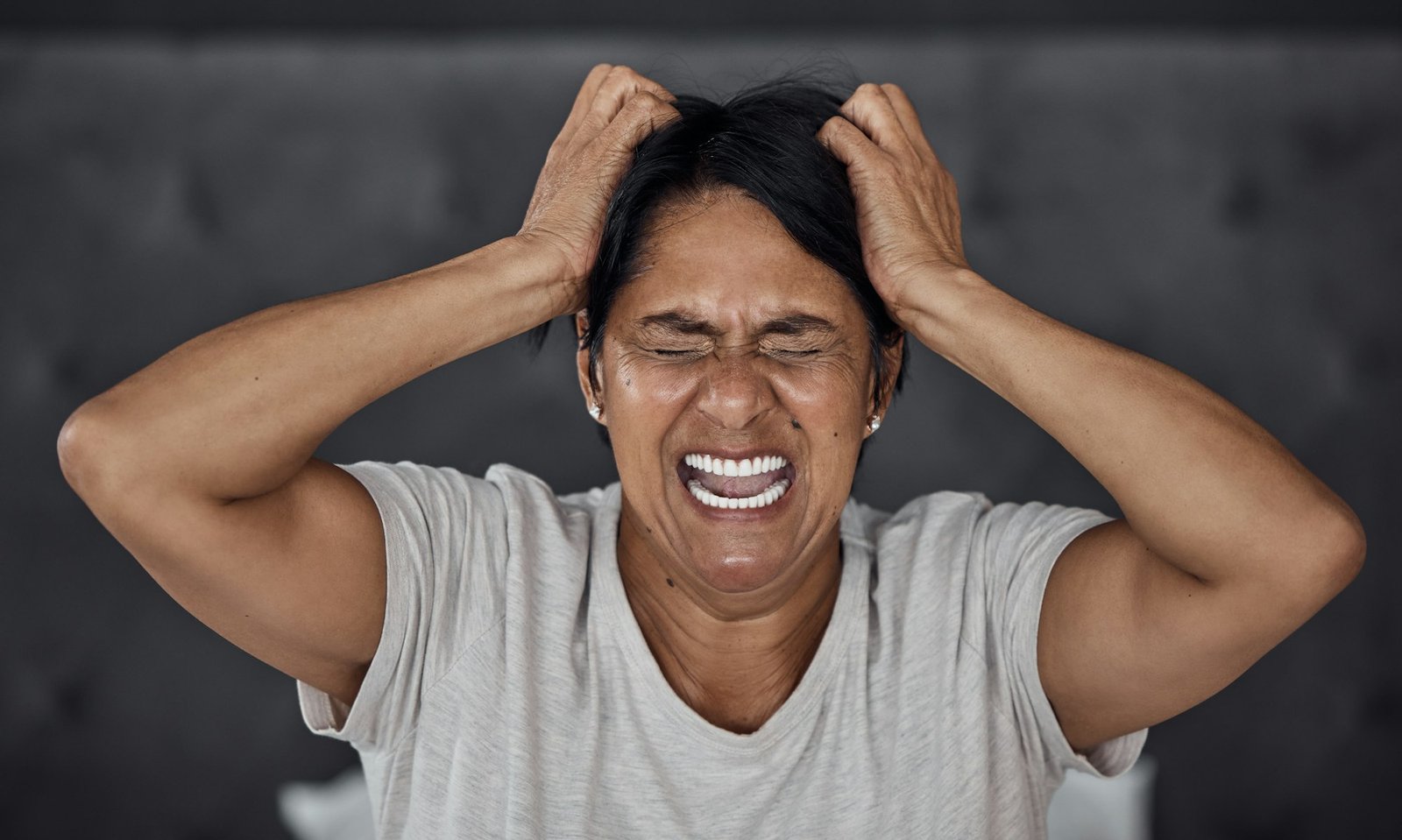Understanding Menopause: Latest Research and Effective Solutions 1 Shouting, headache and elderly woman in bed with insomnia, vertigo or menopause in her home. Scream