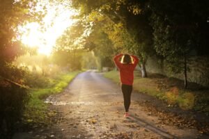 married woman walking on pathway during daytime