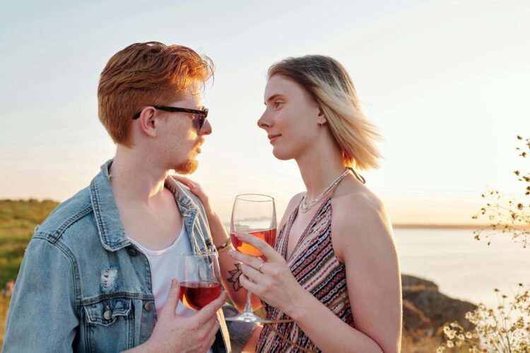 Couple holding wine glasses